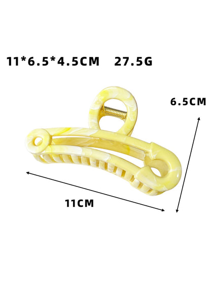 Side view of Beau hollow paperclip claw clip highlighting curved metal prongs