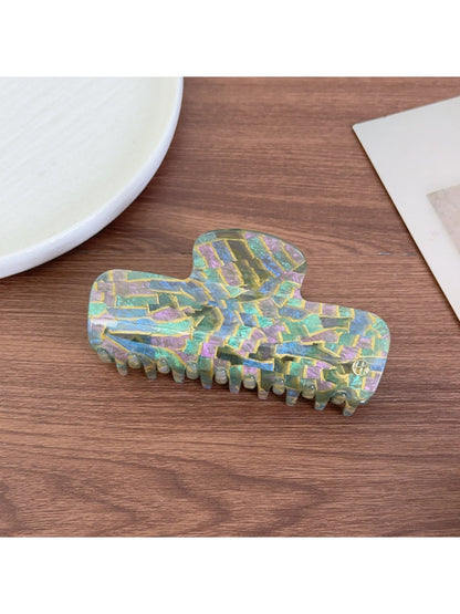 Beau gradient acetate claw clip open, displaying inner teeth and grip design