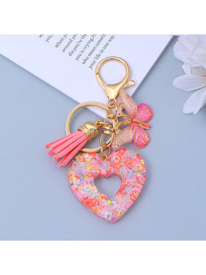 Keypus fashionable heart cutout pendant keychain isolated on white