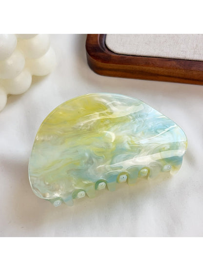 Top view of Beau hair claw clip showing symmetrical cloud pattern