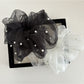 Gifty tulle scrunchie displayed on a white background highlighting its volume