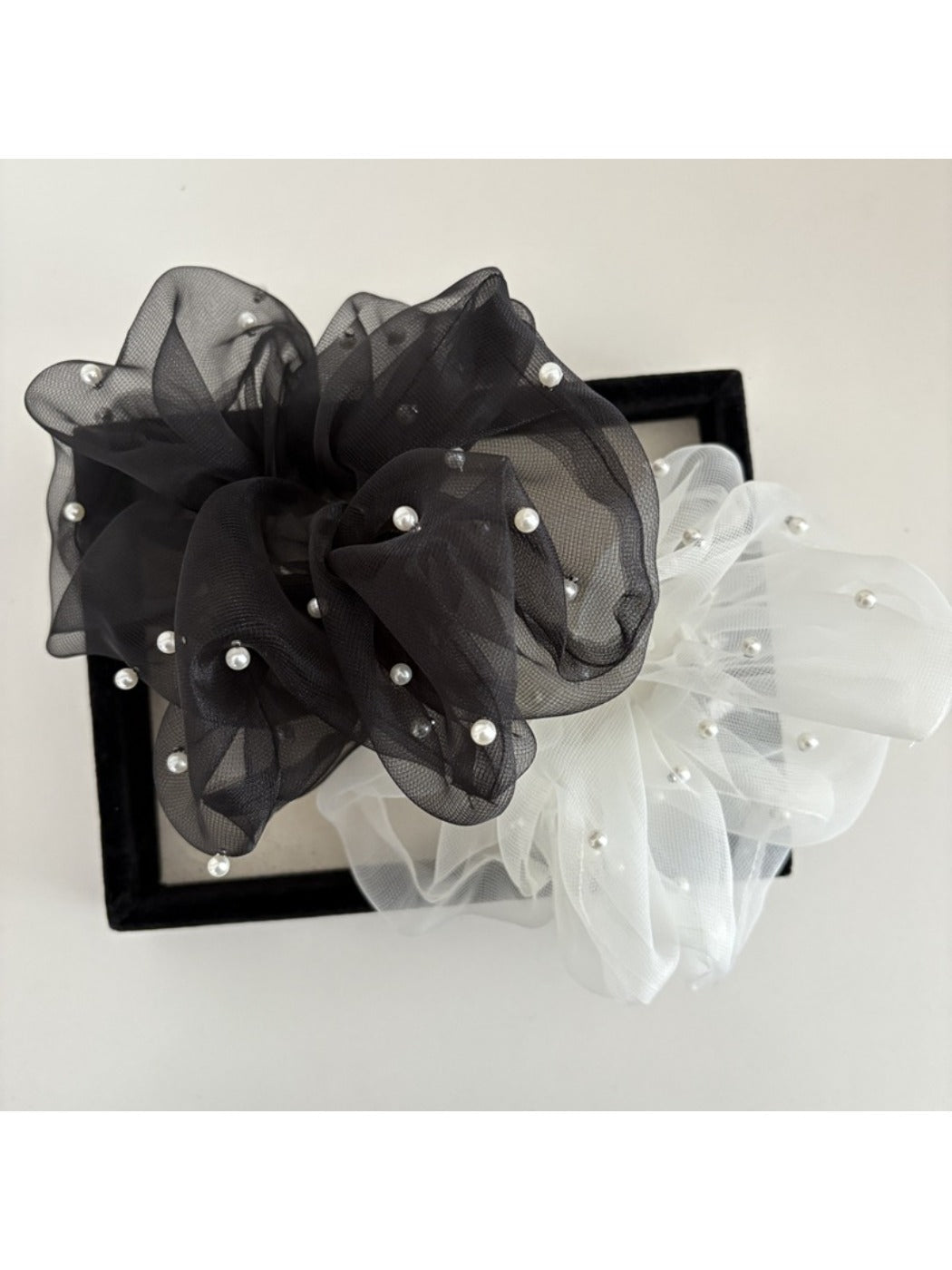 Gifty tulle scrunchie displayed on a white background highlighting its volume