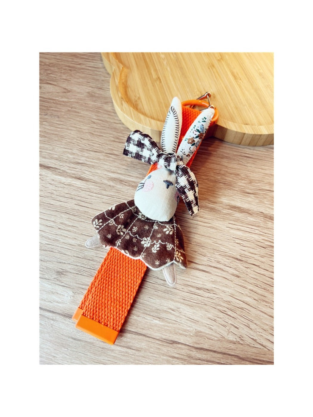Side view of Keypus fabric patchwork keychain highlighting stitching details