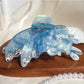 Butterfly hair claw clip with bright colors against a neutral background