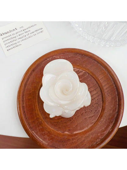 Beau Sweet Rose hair claw clip with pink rose decoration positioned to highlight design