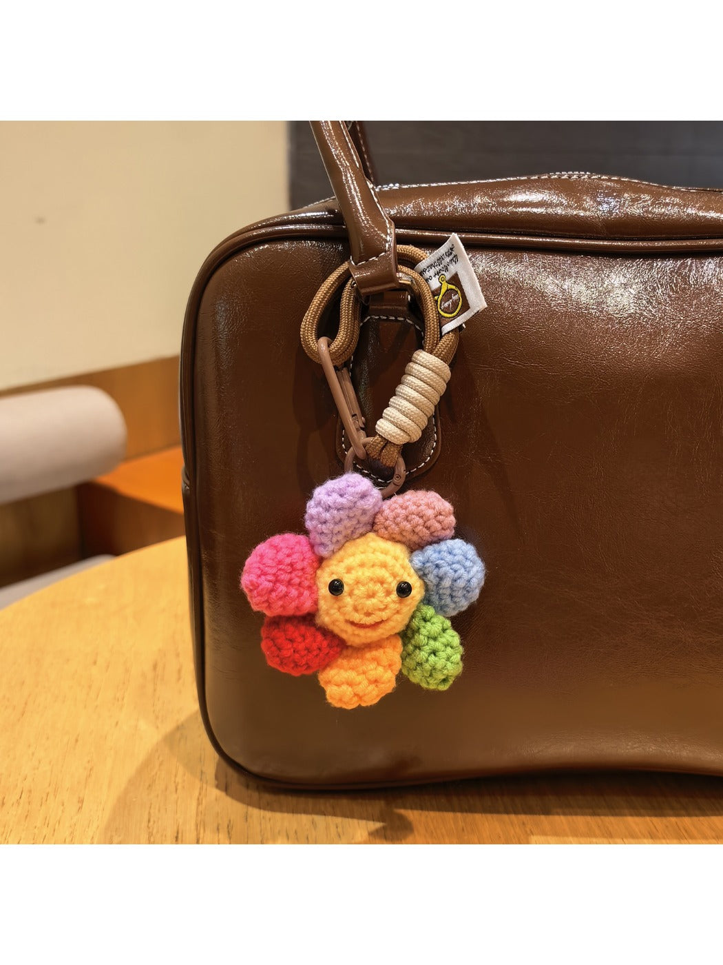 Close-up of Keypus cute flower charm keychain with pastel petals and gold ring