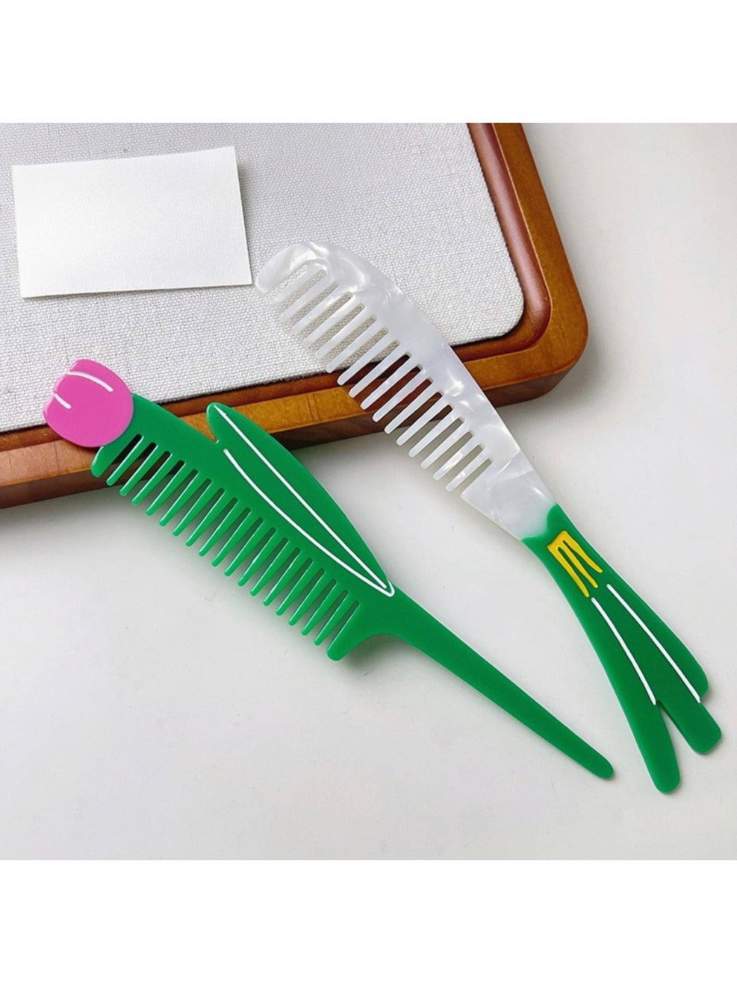 Camerow acetate hair comb placed on a white surface with natural light