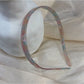Vintage leopard print hairband folded to show inner elastic band