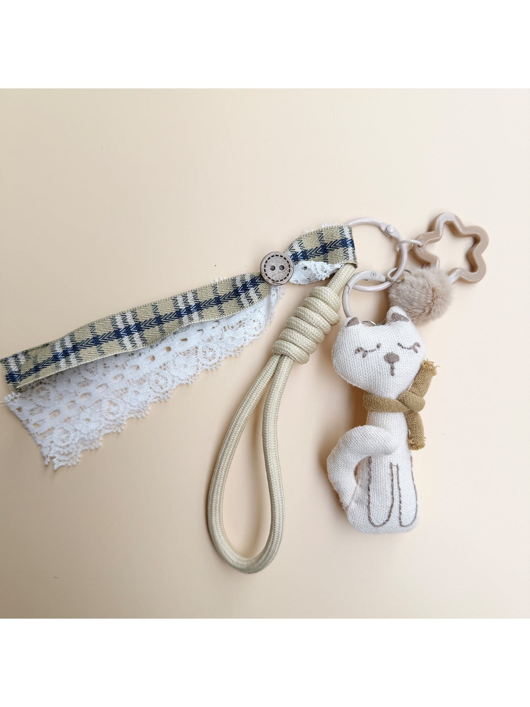 Fabric cat keychain displayed on a white background showing full shape and design