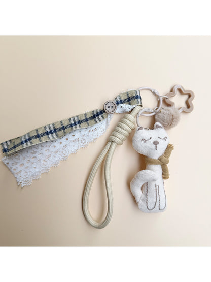Fabric cat keychain displayed on a white background showing full shape and design