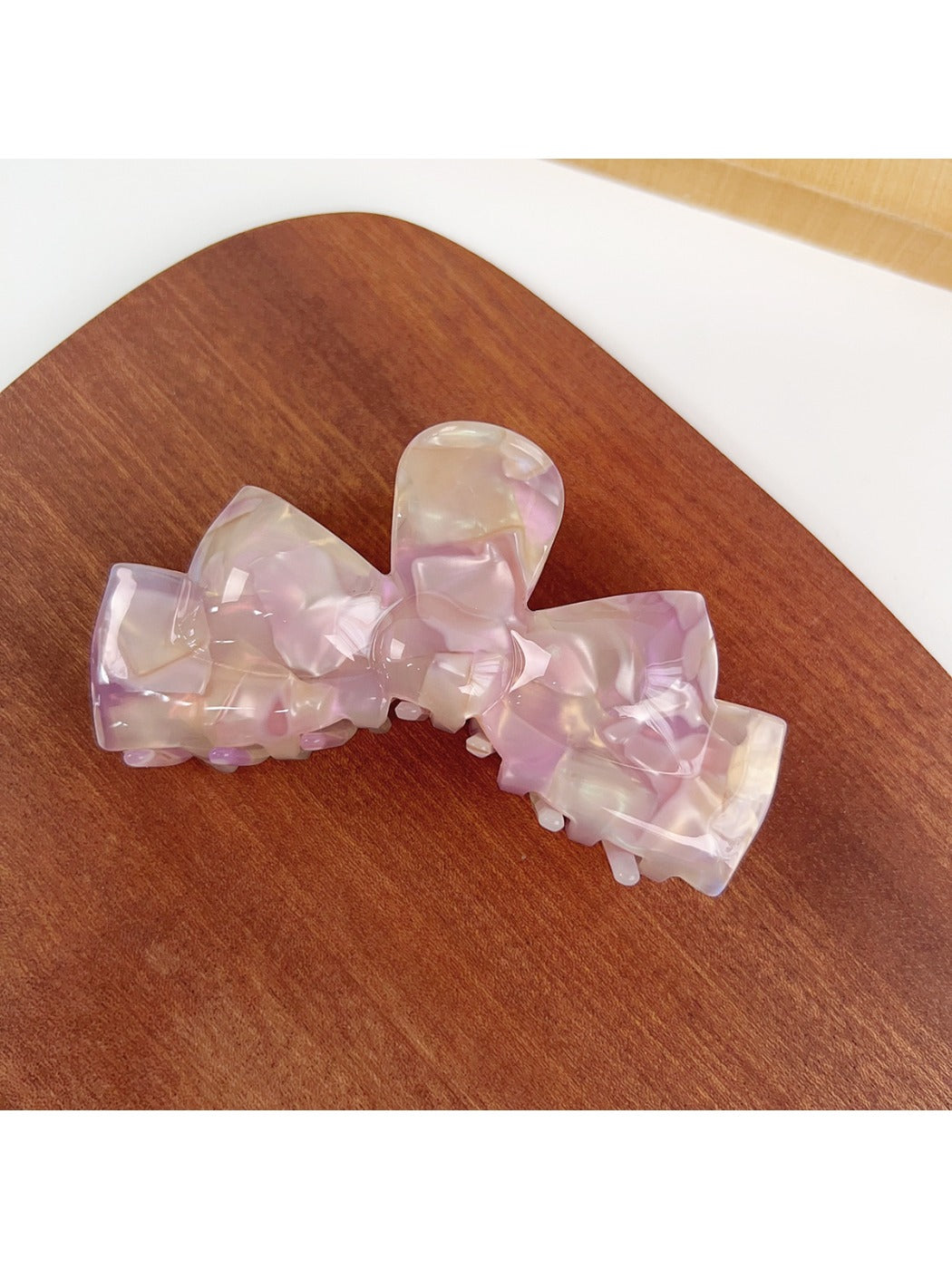 Beau hair claw clip holding dark brown hair in a half-up hairstyle