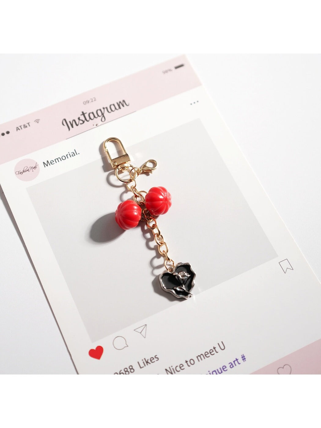 Side angle of Keypus bag charm keychain highlighting metal key ring attachment