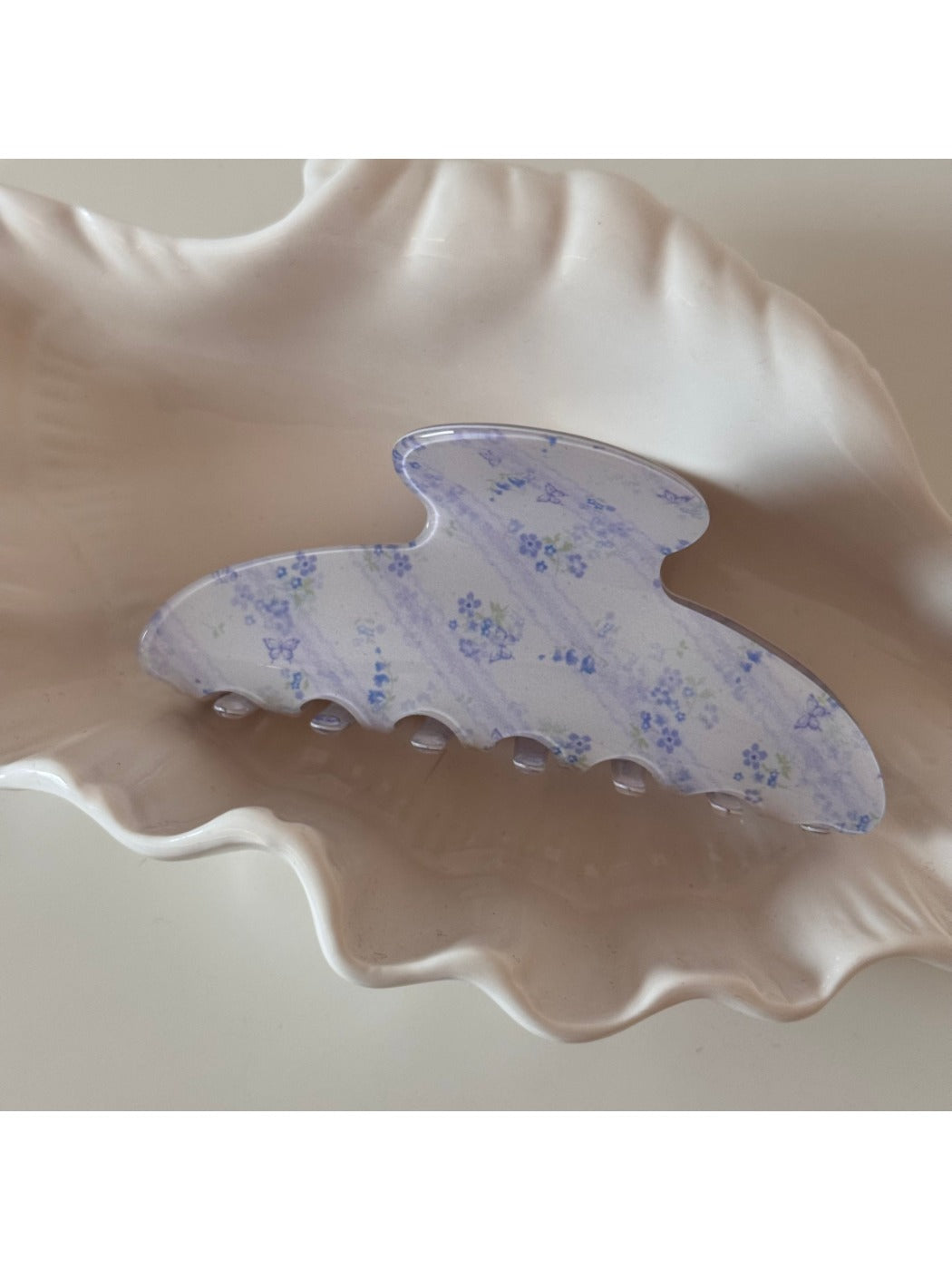 Beau tortoiseshell acetate claw clip displayed open showing spring mechanism