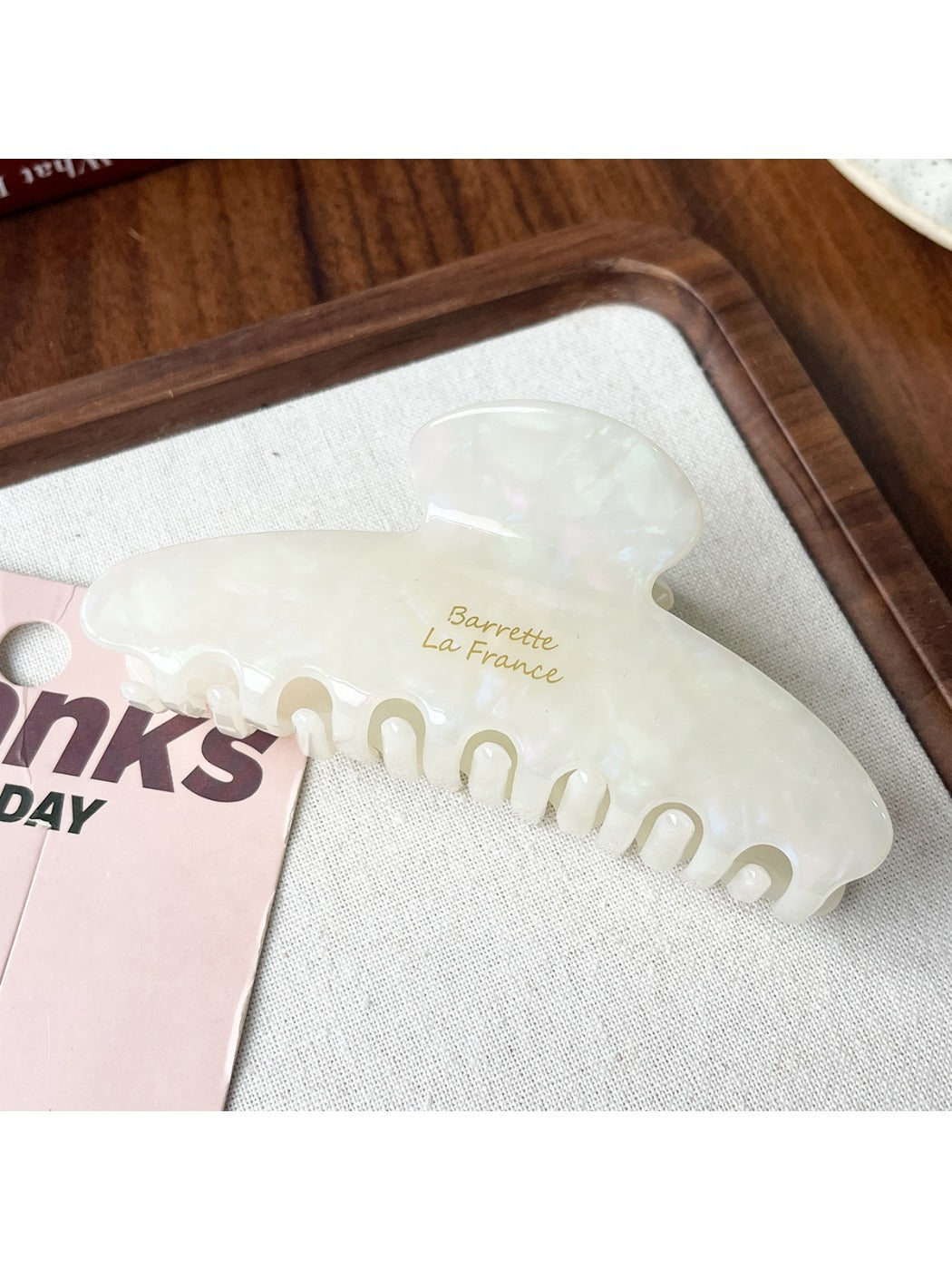 Beau updo claw clip in a neutral beige acetate with subtle marbled pattern