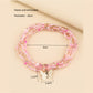 Lovra bracelet showing layered strands of beads and central butterfly detail