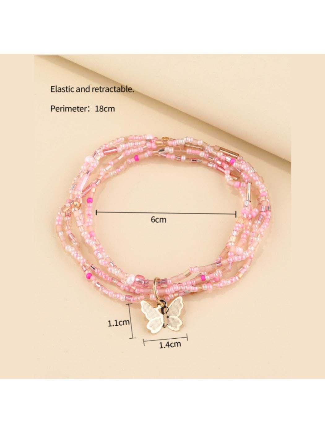 Lovra bracelet showing layered strands of beads and central butterfly detail