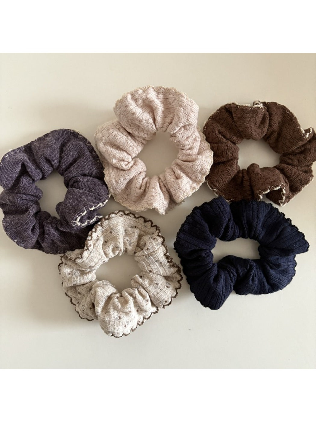 Close-up of Gifty trendy scrunchie with vibrant floral pattern on fabric