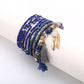 Lovra bracelet packaging with tassel pendant and colorful beads displayed