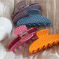 Beau colorful polka dot acetate hair clip on white background