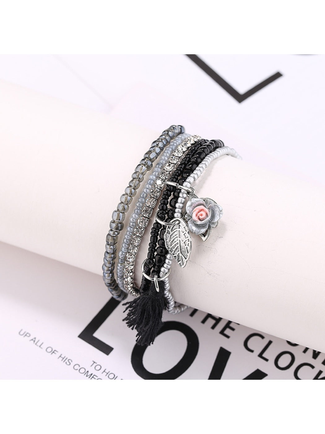 Lovra bracelet displayed flat showing all rows of colorful beads and tassel
