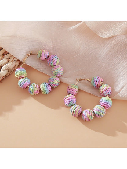 Earedge raffia round ball drop earrings styled with casual outfit on model