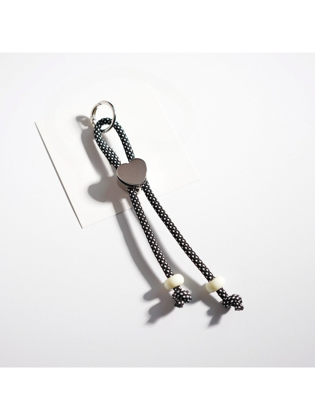 Top view of colorful rope heart keychain showing symmetrical design