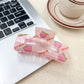 Beau claw clip with a mix of colorful fruits like cherries, lemons, and watermelons