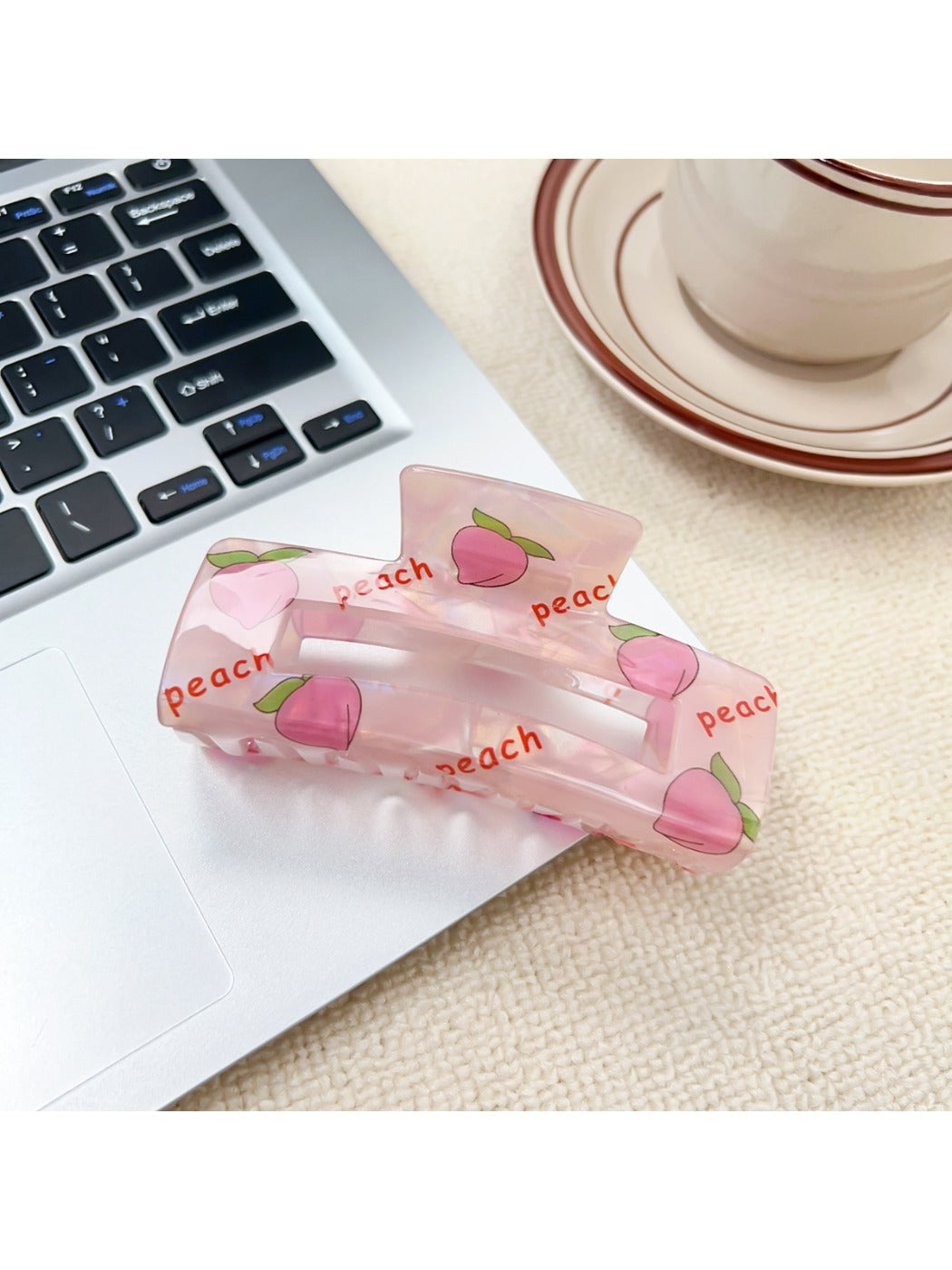 Beau claw clip with a mix of colorful fruits like cherries, lemons, and watermelons