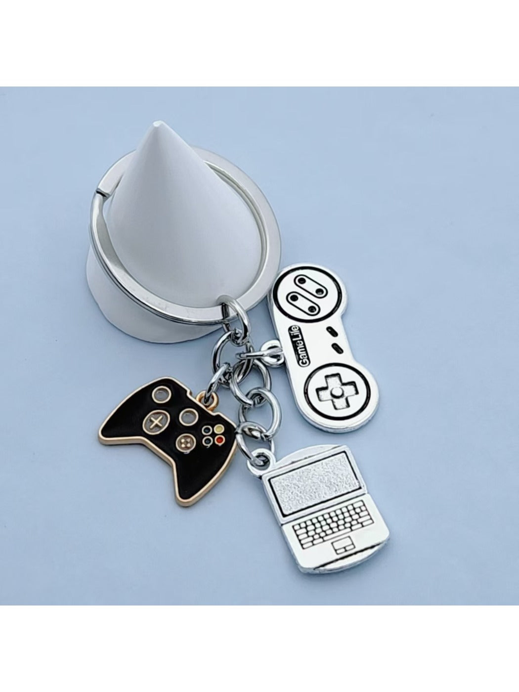 Keypus keychain held in hand to show scale and ergonomic shape of the game controller design