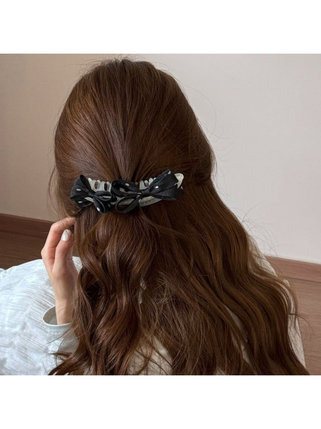 Close-up of Beau polka dot bow banana clip showing bow detail