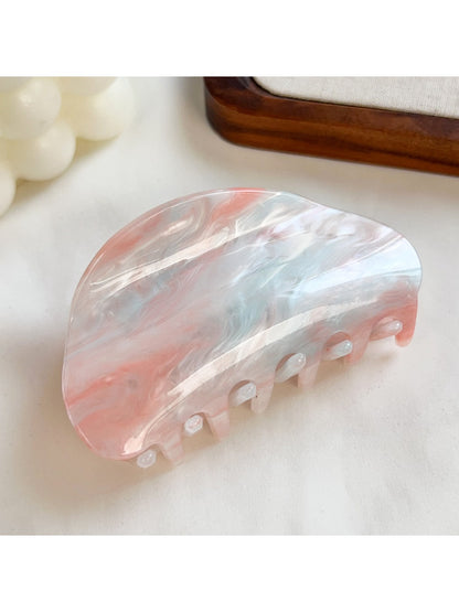Beau hair claw clip placed on a white surface showing full design