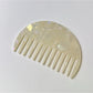 Camerow acetate hair comb held in hand to show size and grip