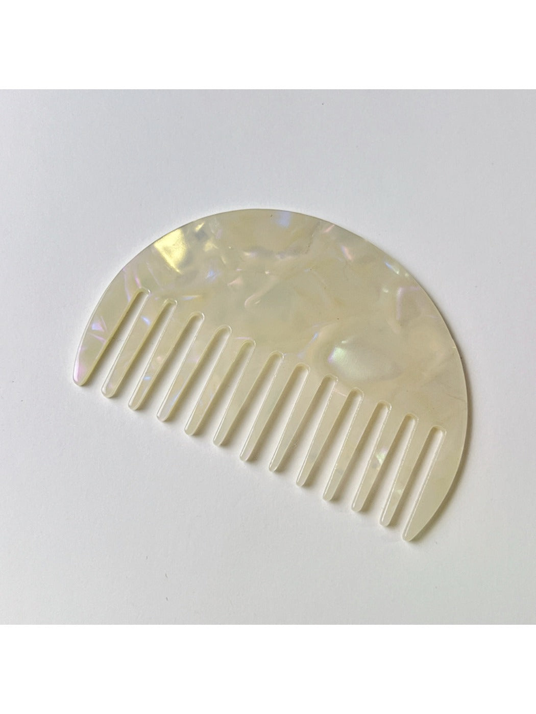 Camerow acetate hair comb held in hand to show size and grip