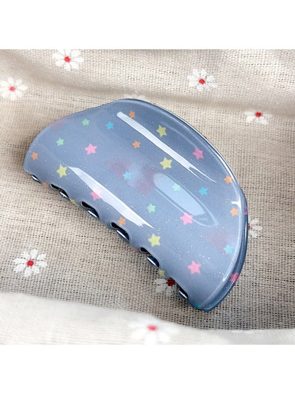 Blue star print hair claw clip open showing inner teeth