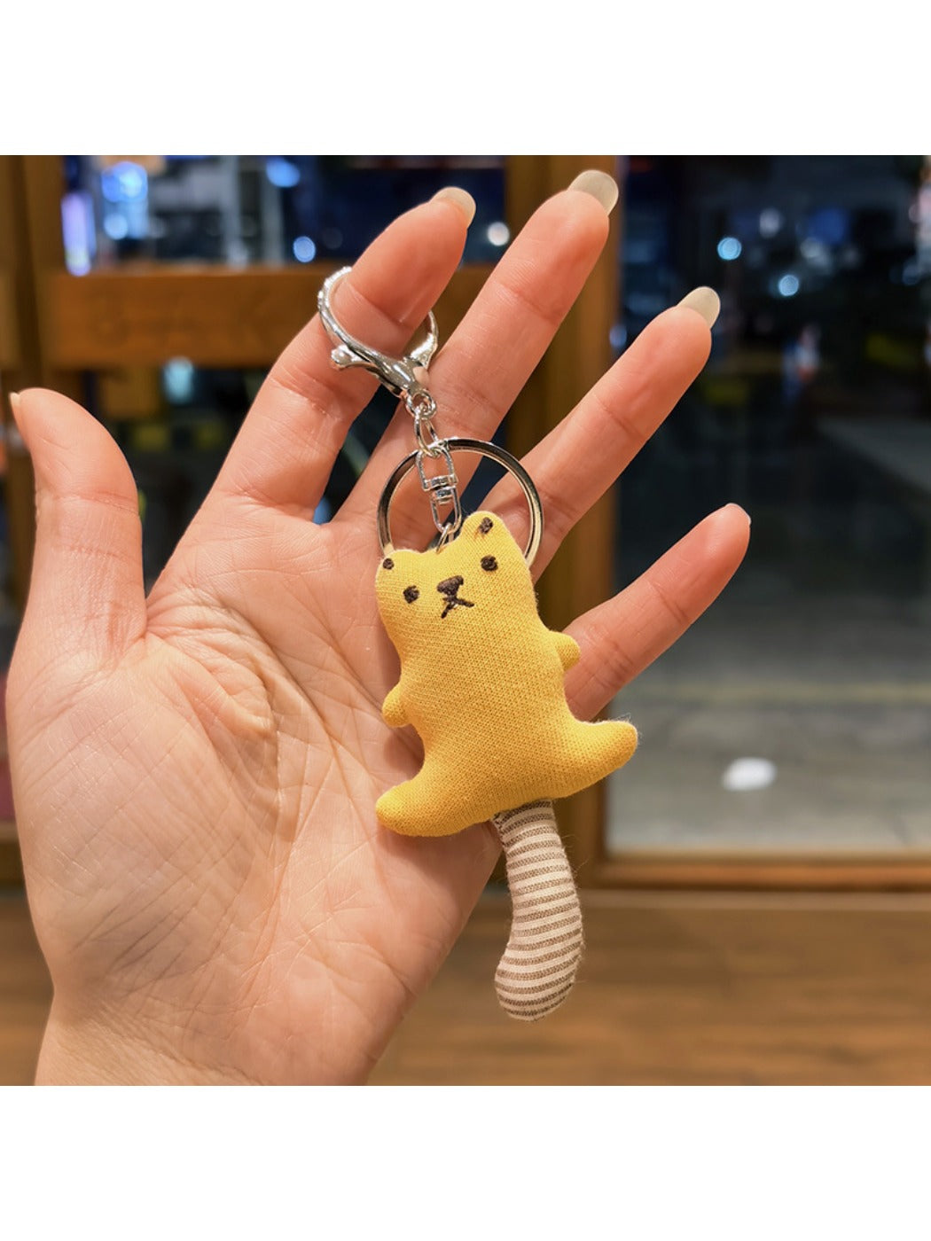 Multiple bear keychains in different colors arranged side by side