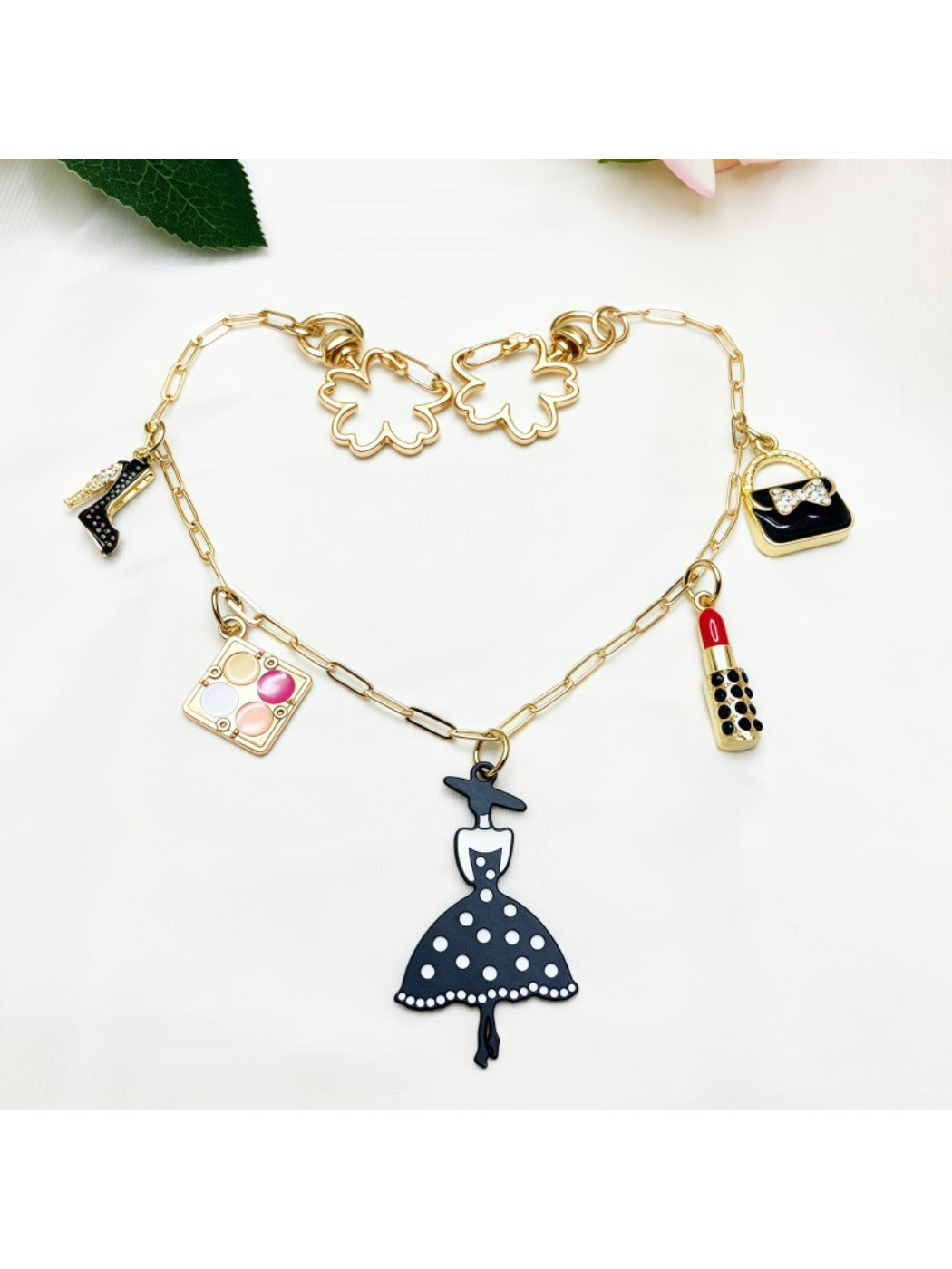 Close-up of Keypus pendant bag charm showing intricate metal design and clasp