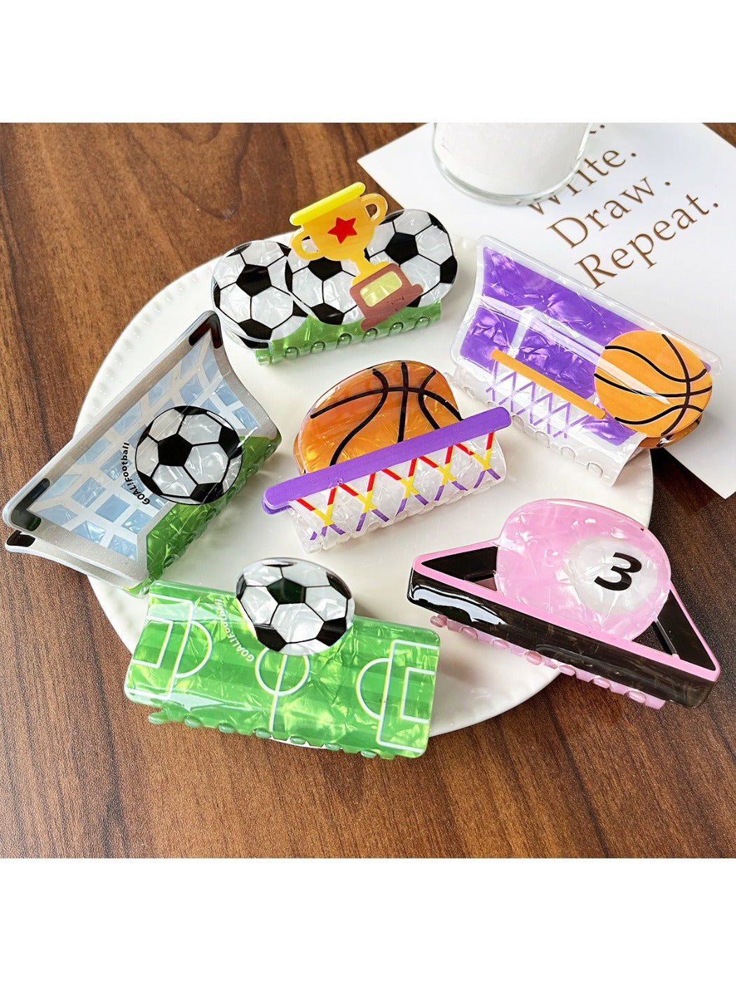 Close-up of Beau claw clip designed as a soccer ball with black and white panels