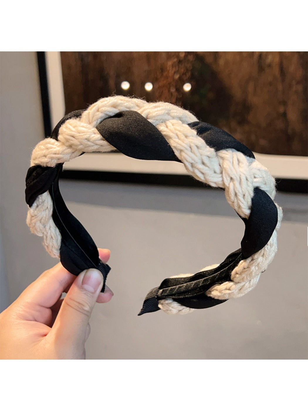 Vintage knitted twist headband displayed flat highlighting twisted design