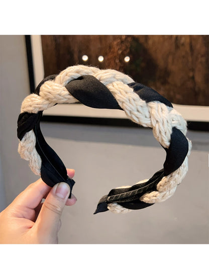 Vintage knitted twist headband displayed flat highlighting twisted design
