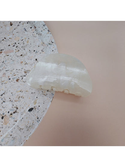 Beau hair clip styled in long hair showcasing its decorative effect