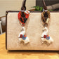 Side view of the alpaca keychain showing detailed stitching and fluffy texture