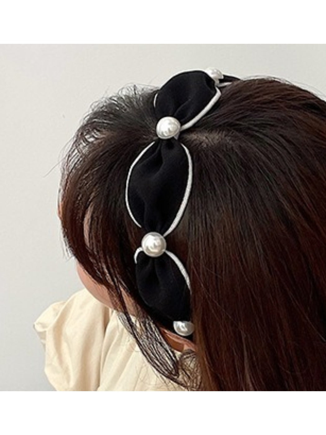 Side view of Gifty vintage chic wide edge headband on mannequin head