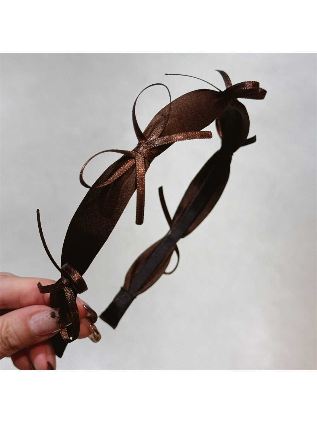 Top view of Gifty ribbon bow headband highlighting bow shape and fabric folds