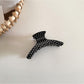 Beau polka dot acetate hair clip angled to show both front and side details
