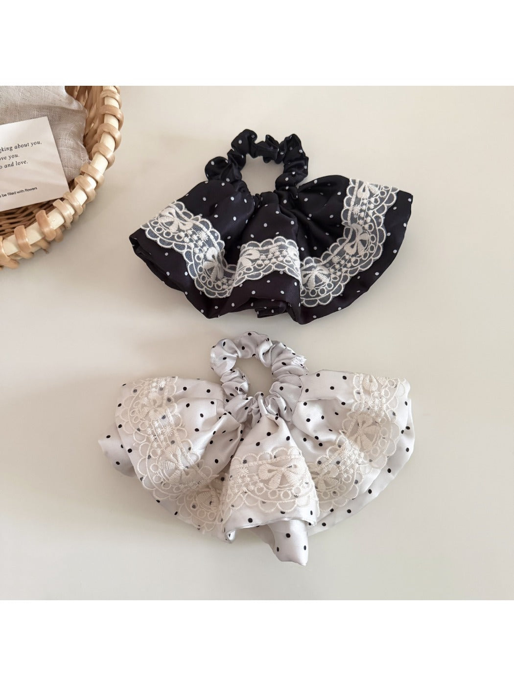 Gifty vintage polka dot hair tie wrapped around a ponytail on a model