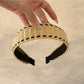 Gifty minimalist wide bohemian headband folded to show flexibility and fabric details
