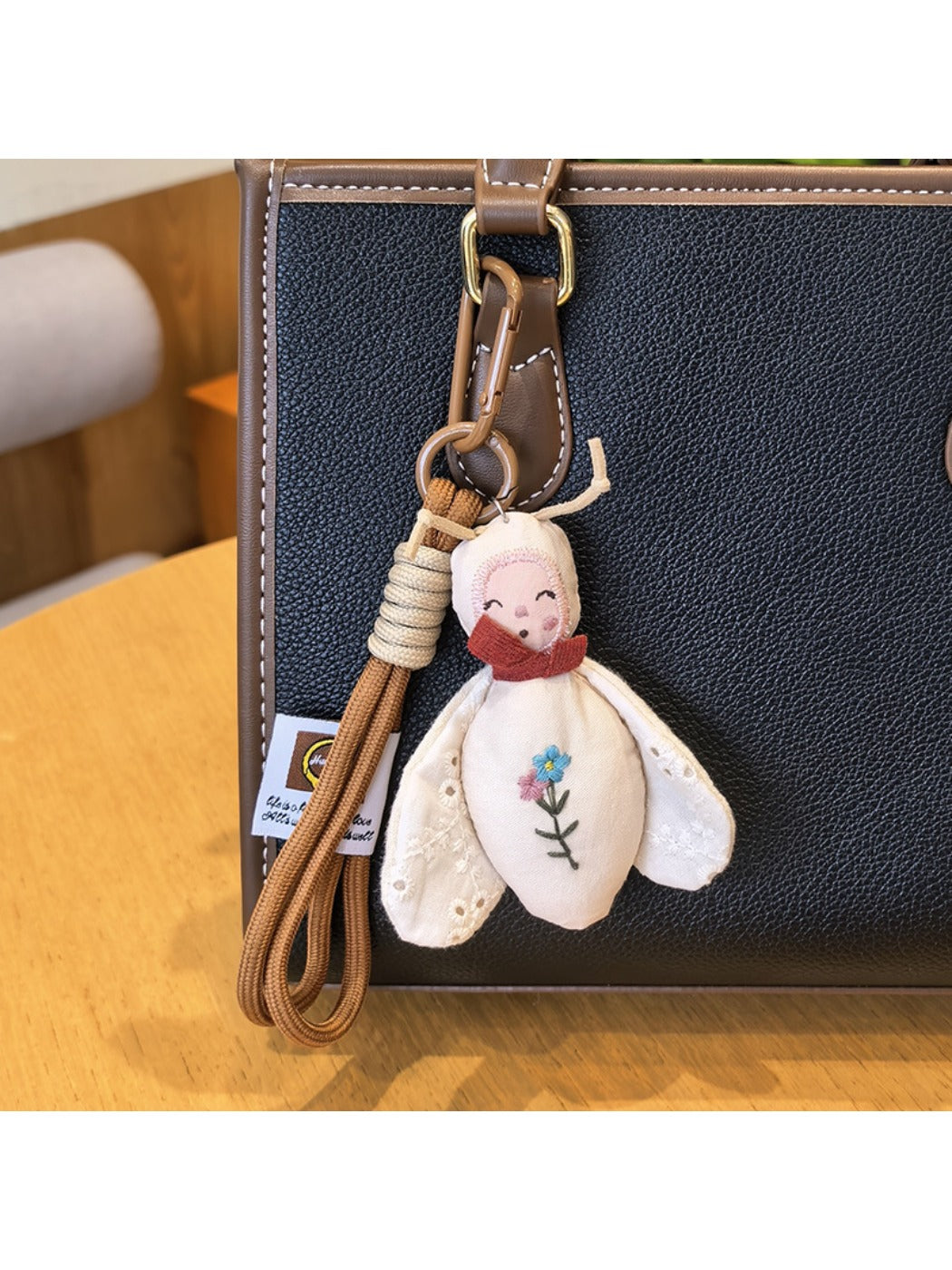 Bee charm keychain displayed against a plain white background