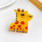 Beau cute animal hair claw clip in beige displayed with other clips