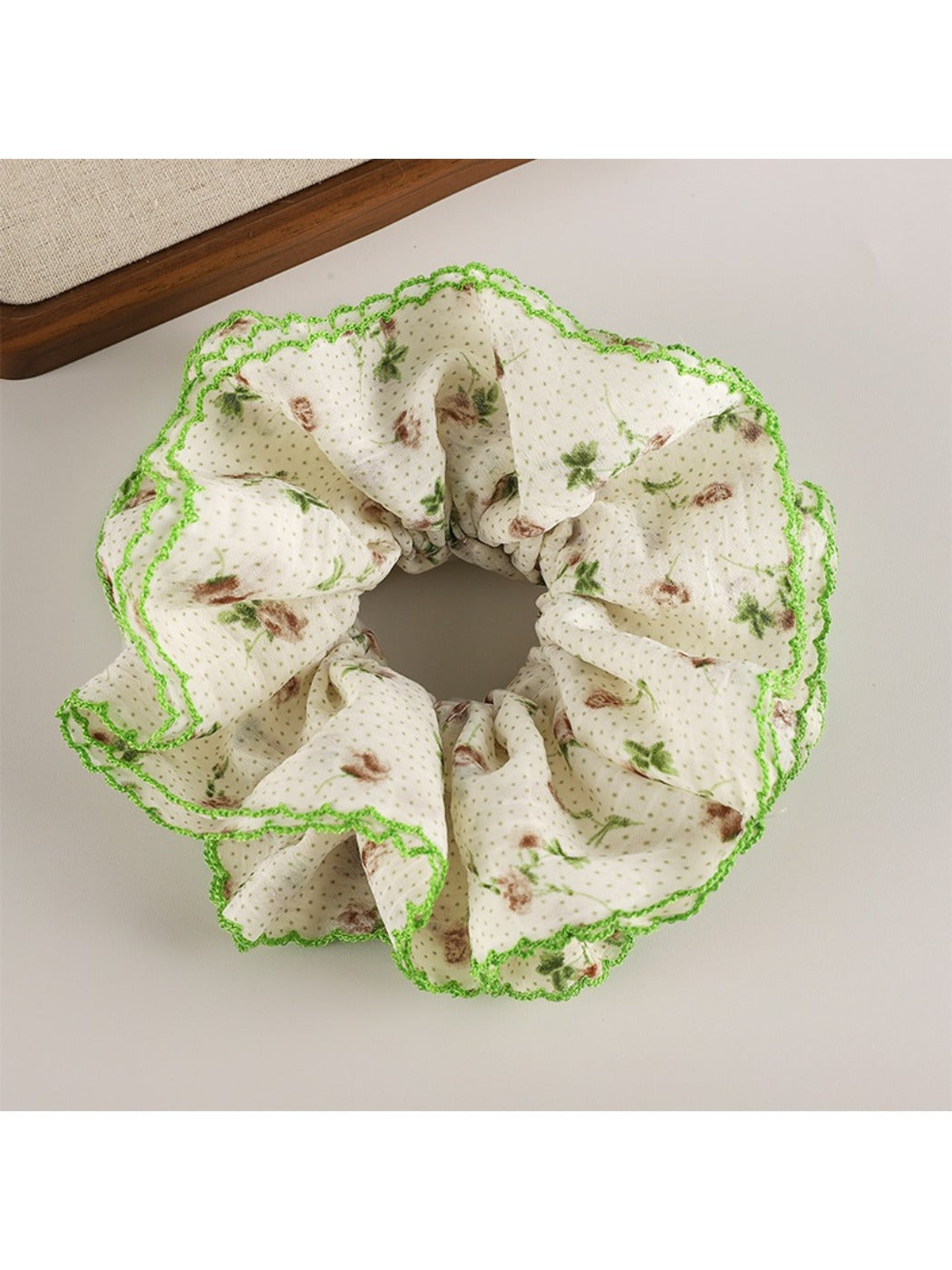 Gifty floral scrunchie displayed with matching floral accessories