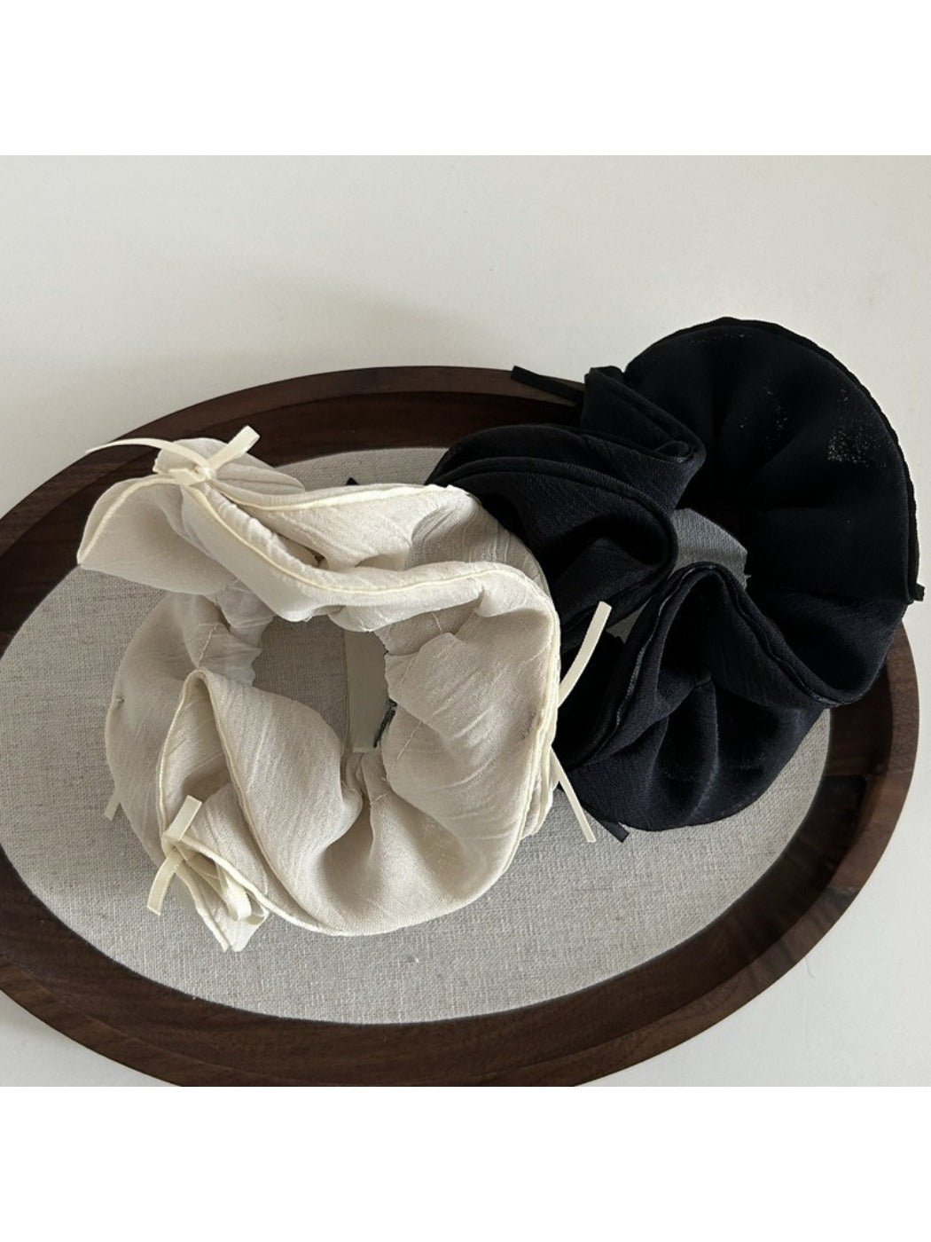 Side view of Gifty double layer chiffon bow scrunchie highlighting fabric texture